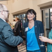 President Mantella conversing with GVSU Alumni